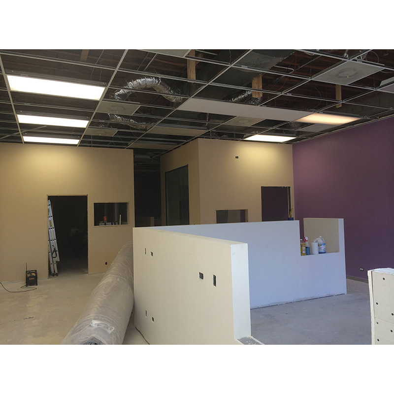 Interior buildout of walls, ceiling and flooring.