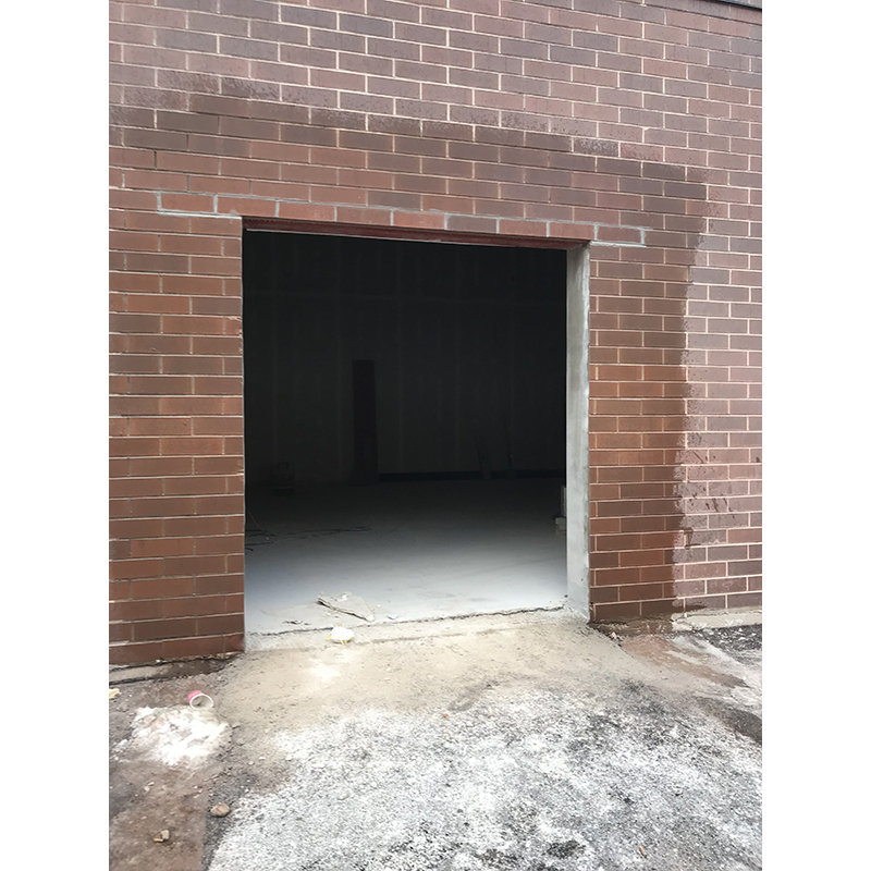 Exterior masonry repair and building. Door and window installation.