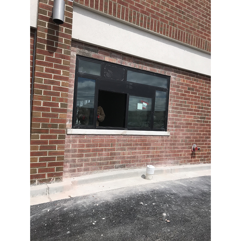 Exterior masonry repair and building. Door and window installation.