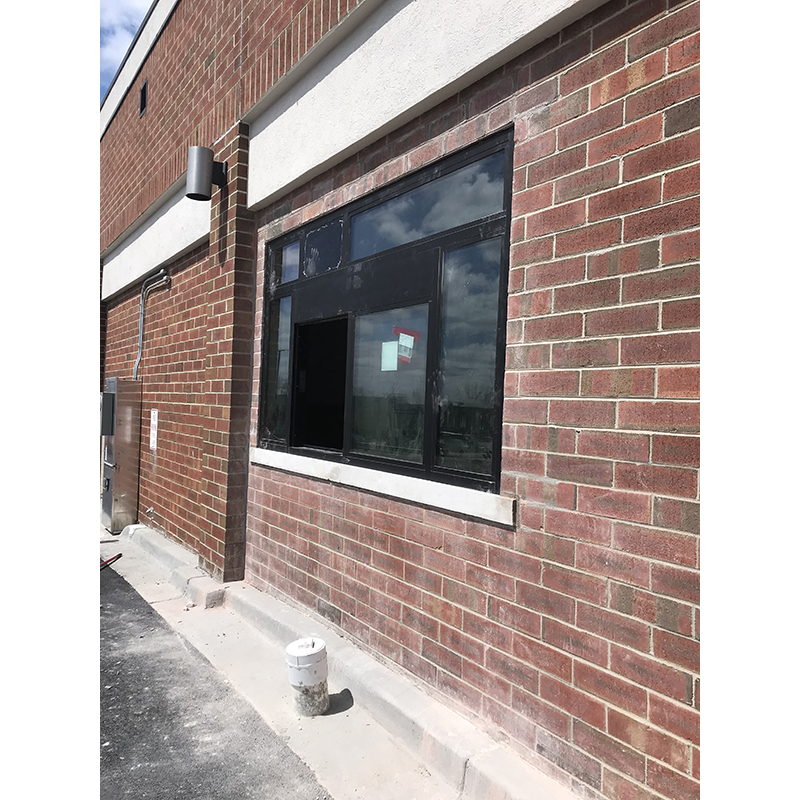 Exterior masonry repair and building. Door and window installation.