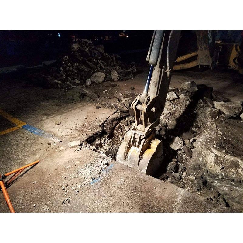 Excavating outside location preparing for sewer line repair.