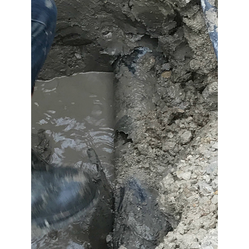 Broken sewer line being prepared for repair work.